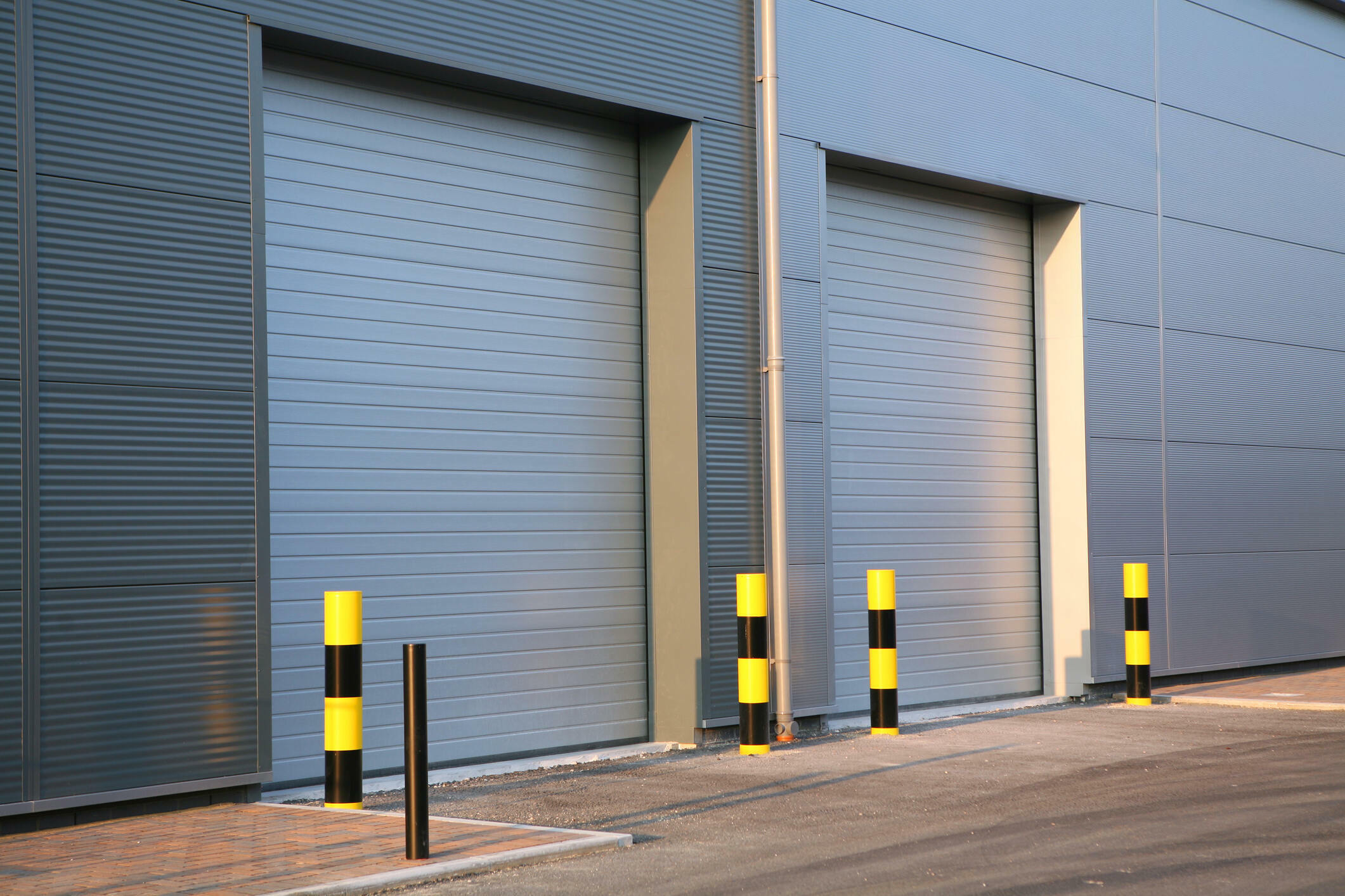 Detail of steel roller-shutter doors on a new industrial unit